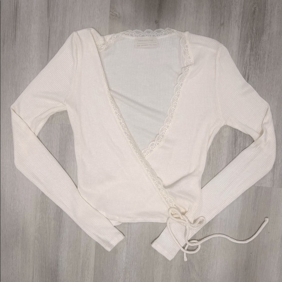This is a Urban Outfitters tie sweater/shirt, it has been worn once.